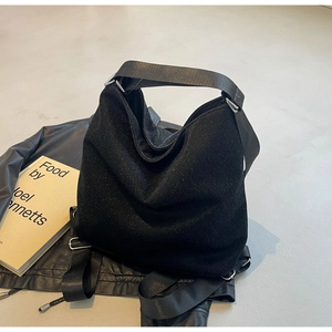 Chic black glitter PU tote bag for women with wide fabric shoulder strap and silver hardware