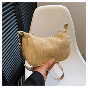 Sac à bandoulière minimaliste en velours côtelé beige avec fermeture éclair métallique