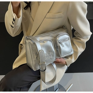 Detail of silver metallic textured PU leather crossbody bag with Juon Hark embroidery