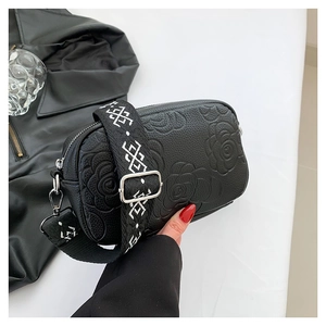 Minimalist black PU crossbody bag with 3D rose flower embossing and wide geometric strap