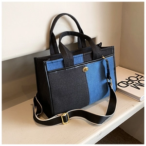 Fashionable patchwork denim crossbody bag with gold hardware and wide shoulder strap