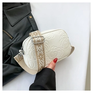 Minimalist white PU leather crossbody bag with rose embossed texture and ethnic strap