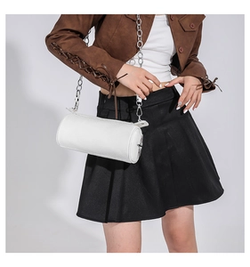 Fashionable white cylindrical PU shoulder bag with silver chain strap on model