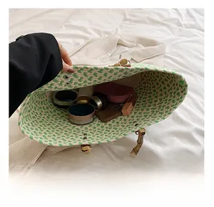 Interior view showing the large capacity of the woven tote bag with bamboo handles