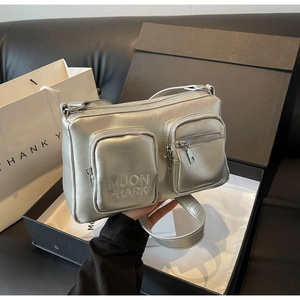Metallic silver PU crossbody bag with crinkled texture and dual front zipper pockets