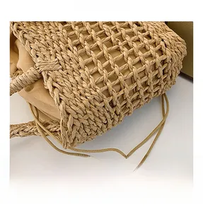 Detailed macro view of handcrafted woven straw texture with a beige drawstring fabric lining