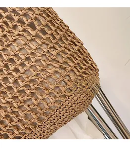 Close-up of hollow woven fabric texture and white fabric lining on a stylish handbag