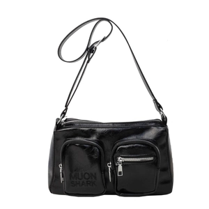 Minimalist black oil-wax PU leather crossbody bag with dual pockets and silver zippers