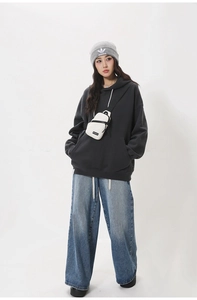 Detailed view of dark grey oversized hoodie with drop shoulders and a front kangaroo pocket