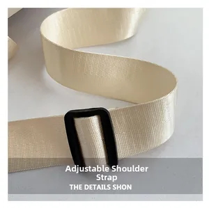 Close-up of adjustable nylon shoulder strap with durable black plastic buckle for women bag