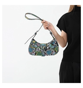 Close-up of a vibrant multi-color snakeskin textured PU leather baguette bag with silver buckle