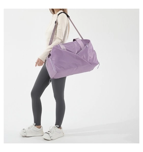 Side view of purple large-capacity crossbody bag shown on model with shoulder strap