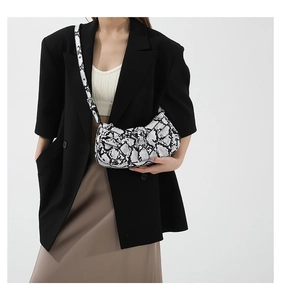 Close-up of the black and white snakeskin pattern on the stylish PU crossbody bag