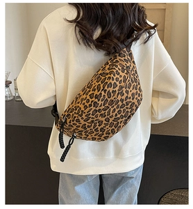 Fashionable leopard print crossbody chest bag worn by model in a casual street style
