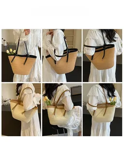 Detail view of woven straw tote bags in khaki and cream with contrasting handles and texture
