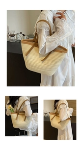 Detail view of woven straw tote bag with brown leather handles and side knot accents