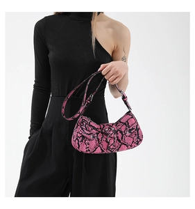 Pink snakeskin PU crossbody bag with silver studs and moto style multi-pocket design
