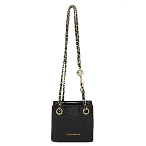 Mini black patent leather crossbody bag with gold chain strap and adjustable gold ball