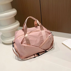 Pink waterproof nylon travel duffel bag with adjustable shoulder strap for women