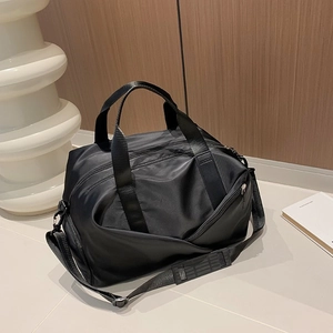 Versatile black nylon crossbody gym bag with dual handles and adjustable shoulder strap
