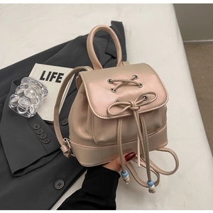 Mini champagne pink PU leather backpack with drawstring closure and bead detail
