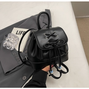 Minimalist black PU leather mini backpack with bow detail and vintage style top handle