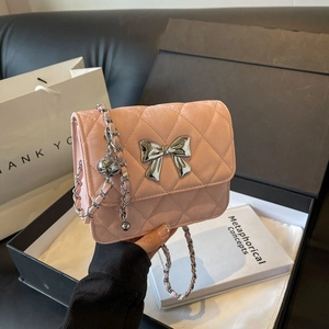 Pink quilted shoulder bag with silver bow and chain strap in elegant gift box