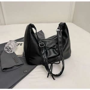 Chic black soft PU leather crossbody hobo bag with trendy decorative lace-up bow design
