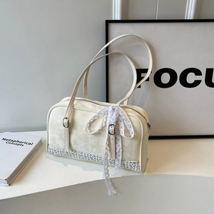 Elegant off-white Boston handbag with floral pattern base and white lace bow detail