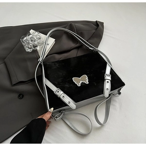 Y2K style black velvet shoulder bag with silver butterfly and metallic strap details