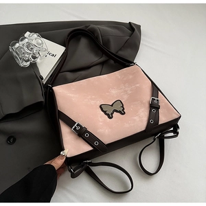 Chic pink and brown PU leather crossbody handbag with butterfly metal logo and retro vibe