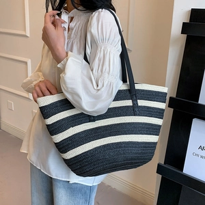 Minimalist black and white striped woven tote bag with long leather straps for women