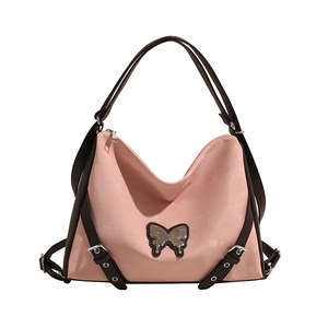 Pink PU leather tote bag with silver butterfly charm and brown contrasting straps