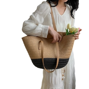Chic color-block woven straw tote bag with dual handles and long shoulder strap for summer