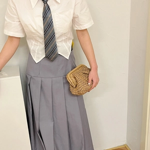 Japanese JK style white shirt and grey pleated long skirt with a woven straw bag