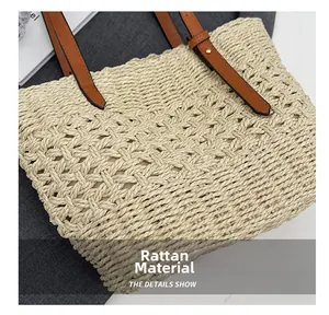 Macro detail of natural straw fabric texture and brown leather strap with gold buckles