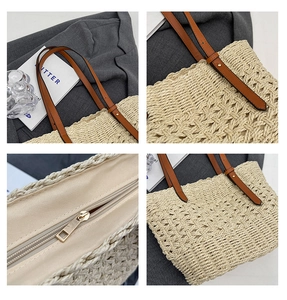 Detail view of woven straw tote bag featuring brown leather straps and zip closure