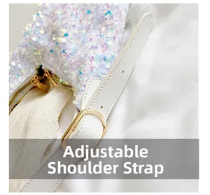 Close-up of adjustable leather shoulder strap and gold buckle on sequin tote bag