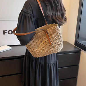 Fashionable hollow paper rope woven beach bag with premium brown leather shoulder straps