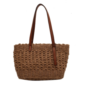Fashionable hollow straw beach tote bag with brown leather handles for summer vacation