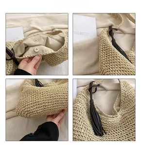 Detail view of woven straw tote bag featuring magnetic buckle, lining, and tassel