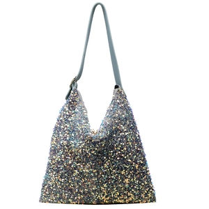 Macro detail of multi-color sequins on a Hobo bag with light blue synthetic strap