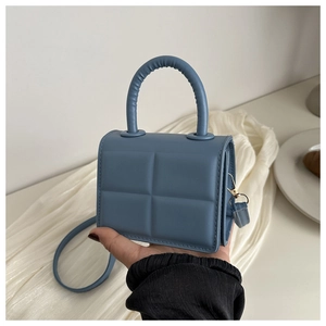 Quilted fog blue PU leather mini handbag with a top handle and gold-tone metal hardware
