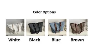 Vista dettagliata di grandi borse tote in bianco, nero, denim blu e texture marroni