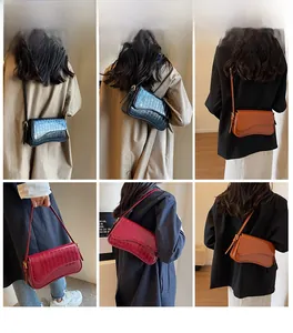 Three-color variety of faux crocodile leather baguette bags in black, caramel, and wine red
