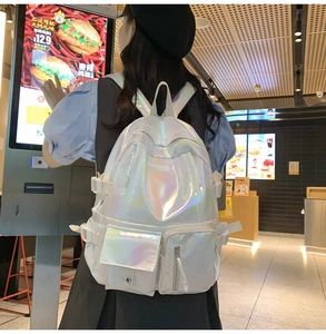 Detailed view of white holographic backpack with large capacity and multi-pocket design
