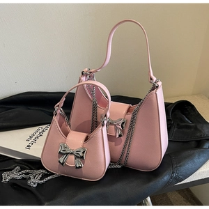 Detailed comparison of pink bow hobo bags in large and small sizes with silver chains