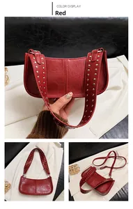 Detail view of red rivet shoulder bag with glossy oil-wax leather and silver metal studs