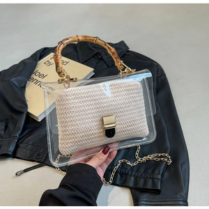 Transparent PVC handbag with bamboo handle, woven inner pouch, and gold chain strap