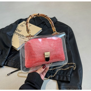 Fashionable transparent PVC tote bag with pink woven lining and bamboo top handle